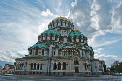 Low angle view of cathedral against cloudy sky