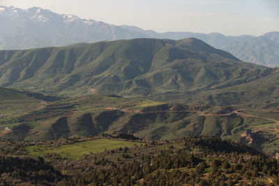 Scenic view of landscape and mountains against sky