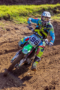 High angle view of man riding motorcycle on field