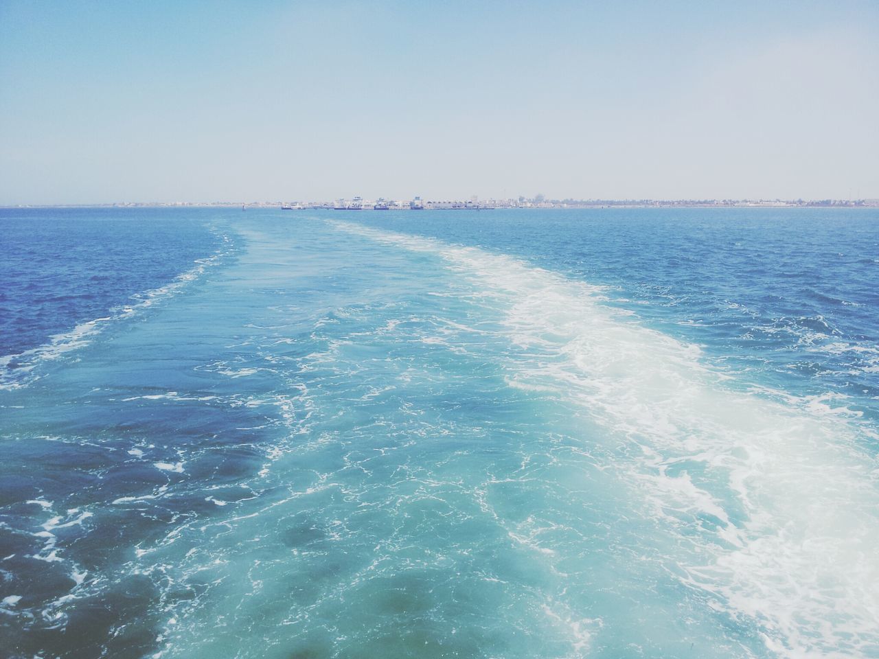 sea, water, horizon over water, clear sky, scenics, wave, beauty in nature, blue, waterfront, nature, tranquil scene, surf, copy space, tranquility, seascape, rippled, motion, idyllic, beach, day