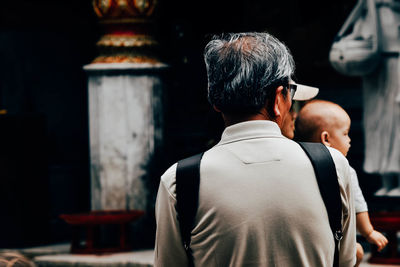 Rear view of man at temple