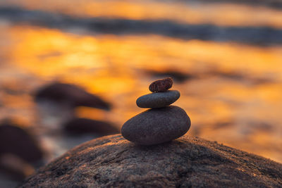 Sunset with stones at baltic sea