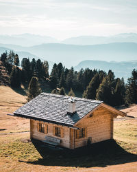 Built structure on field against sky