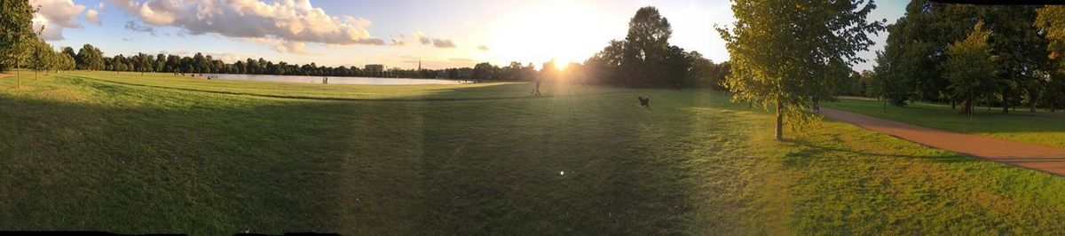 Panoramic view of golf course against sky