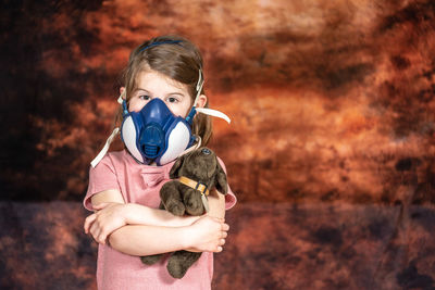 Portrait of boy holding camera