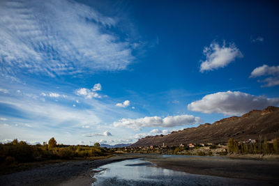 Road amidst landscape against sky