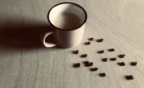High angle view of coffee cup on table