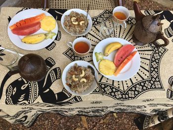 High angle view of breakfast served at table on ground