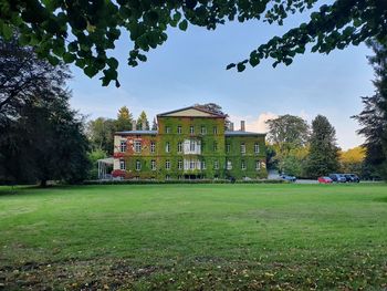 Houses in park against sky