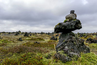 Close-up of rock against sky