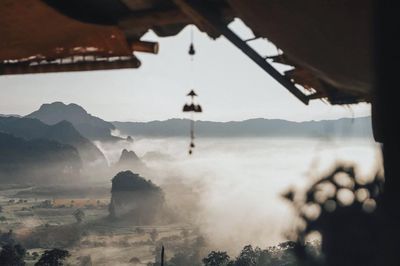 Panoramic view of buildings and mountains against sky