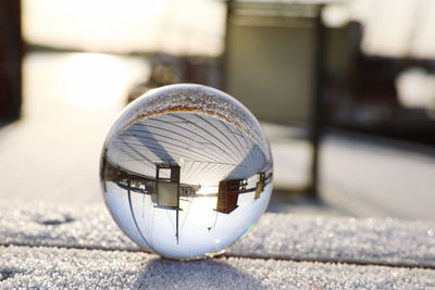 Close-up of crystal ball on street