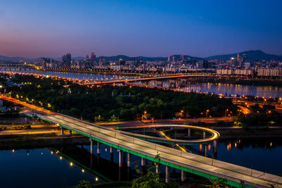 High angle view of light trails on bridge over river