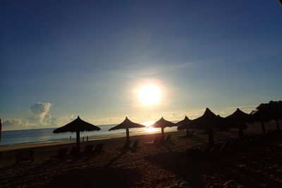 Scenic view of beach against sky during sunset