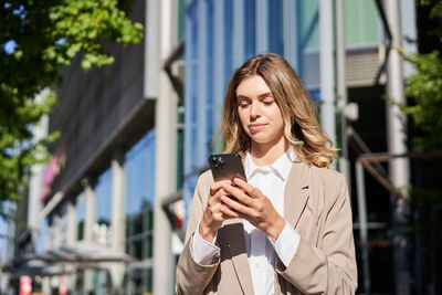 Young woman using mobile phone