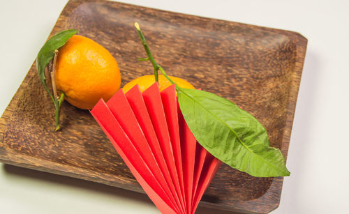 High angle view of orange fruits on table