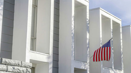 Low angle view of flag against building