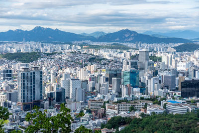 Aerial view of cityscape against sky