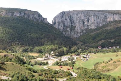 Scenic view of landscape and mountains against sky