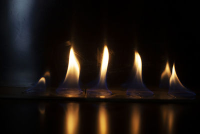 Close-up of burning candles