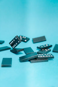 Close-up of objects on table against blue background