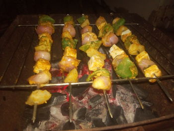 High angle view of meat on barbecue grill