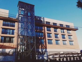 Low angle view of building against blue sky