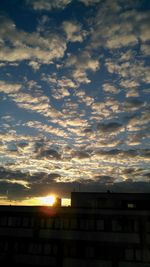 Low angle view of cloudy sky at sunset