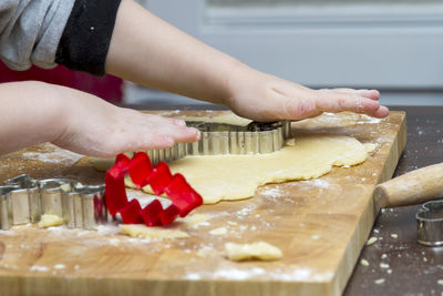 Close-up of woman preparing food in kitchen