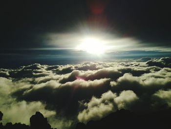 Scenic view of mountains against cloudy sky