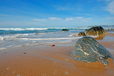 Scenic view of beach against sky
