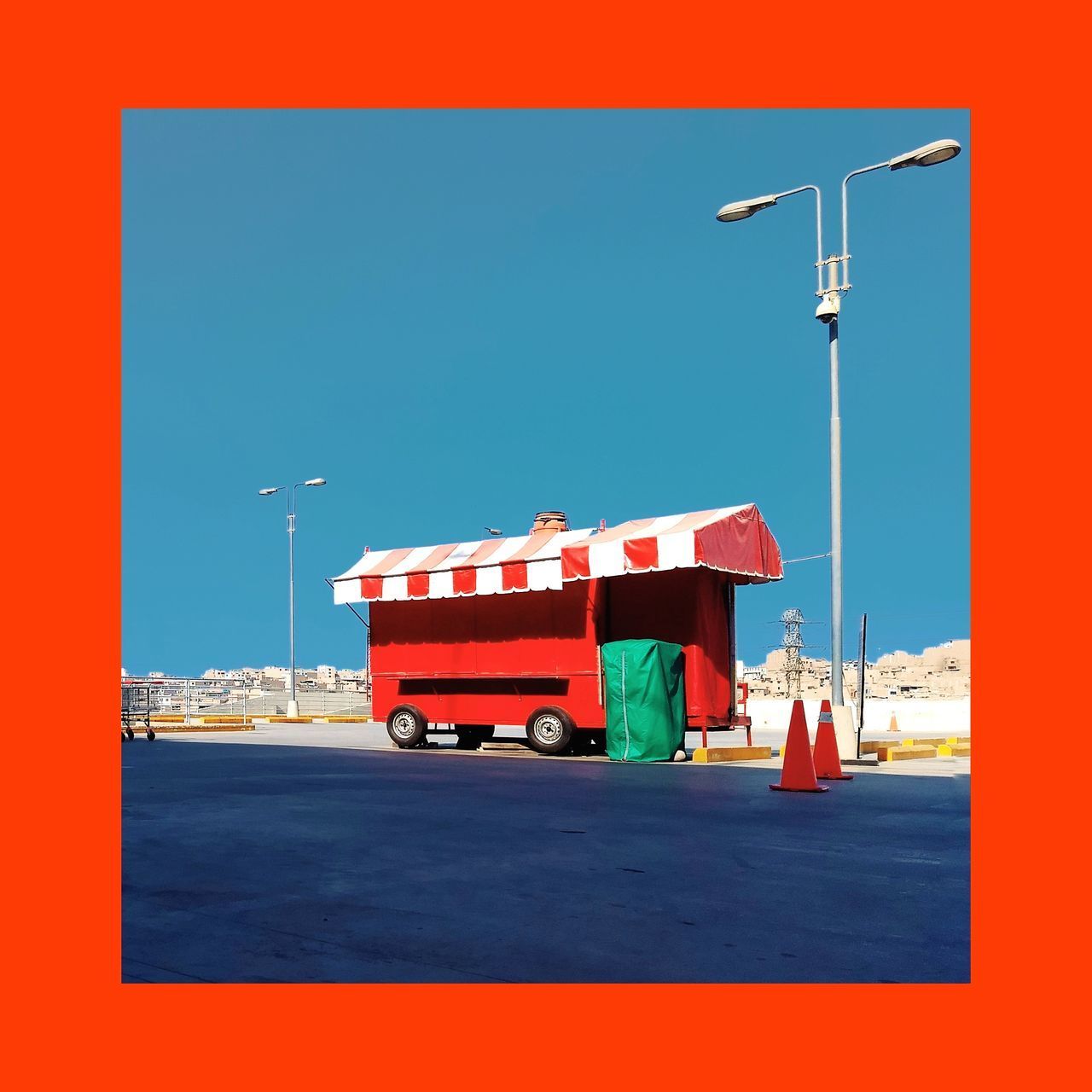 RED UMBRELLA AGAINST CLEAR BLUE SKY