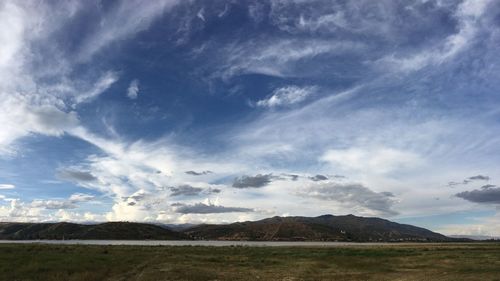 Scenic view of landscape against blue sky