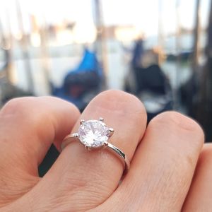 Close-up of hand holding ring