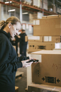 Woman working in front of building