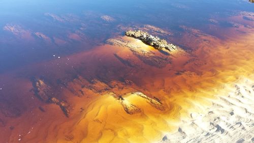 Aerial view of yellow landscape against sky