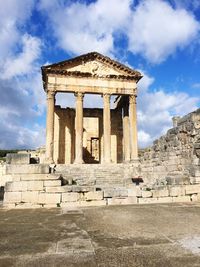 Old ruins of temple against cloudy sky