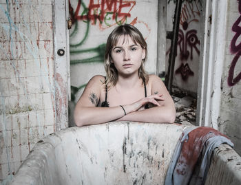 Woman in abandoned bathroom