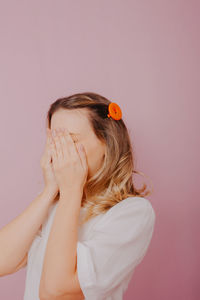 Portrait of woman against white background