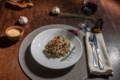 High angle view of porcini risotto served on table