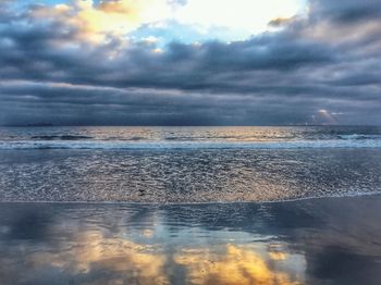 Scenic view of sea against sky at sunset