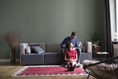 Couple relaxing together in the living room