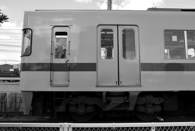 Train at railroad station against sky