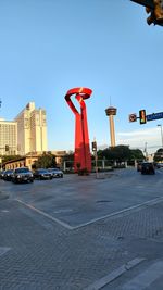 City street and buildings against clear sky