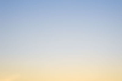 Low angle view of clear sky at sunset