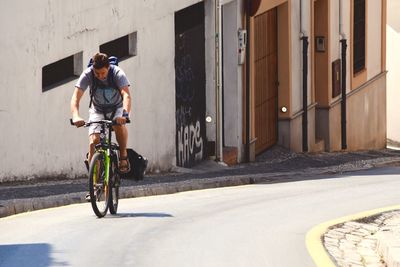 Man cycling on footpath