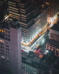 High angle view of illuminated buildings at night