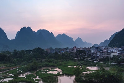 Scenic view of landscape against sky during sunset