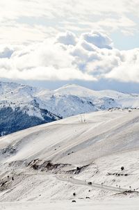 Scenic view of snow mountains against sky