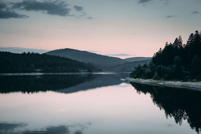 Scenic view of lake against sky during sunset